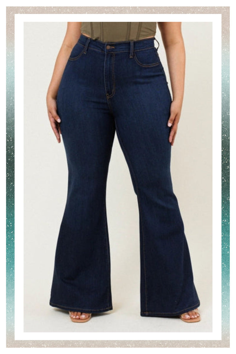 Bottoms Collection. Woman in Vibrant Plus Tall Dark Stone Bell Flare Jean.