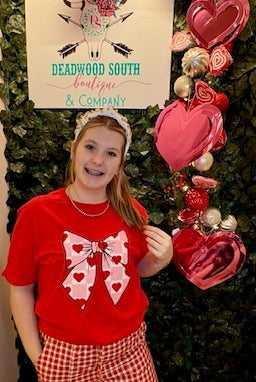 Feel the Love Bow Graphic Tee - Deadwood South Boutique & Company LLC