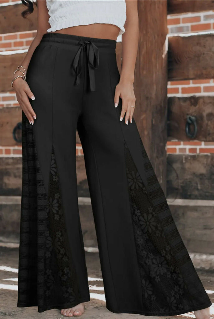 Bottoms Collection. Woman in Vibrant Plus Tall Dark Stone Bell Flare Jean.