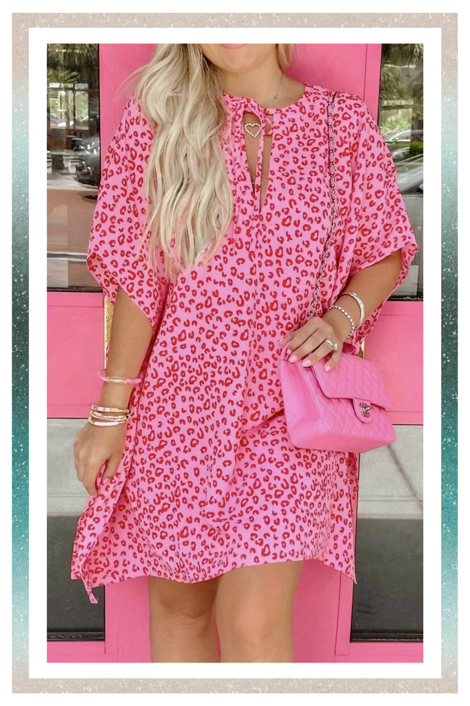 Dress Collection. Woman in a Wild N Pink Leopard Dress from Vintage Cowgirl.