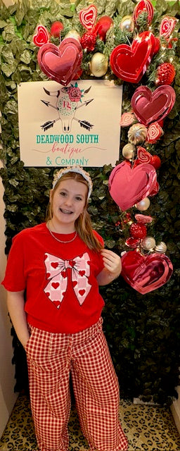 Feel the Love Bow Graphic Tee-Graphic Tees-Deadwood South Boutique & Company LLC-Deadwood South Boutique, Women's Fashion Boutique in Henderson, TX