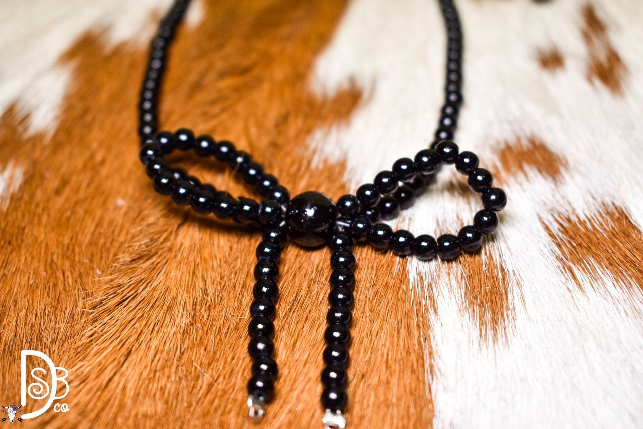 The Fashion Black Beaded Bow Necklace - Deadwood South Boutique & Company LLC